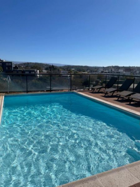 Departamento DE 2 DORMITORIOS CENTRICO CON COCHERA Y PILETA